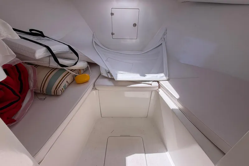 Slide: The Image of Interior cabin of a 1977 Bertram 31 Flybridge Cruiser with cushions and storage. - 28