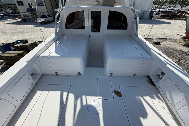 Slide: The Image of 1977 Bertram 31 Flybridge Cruiser deck, showcasing spacious seating and storage areas. - 7