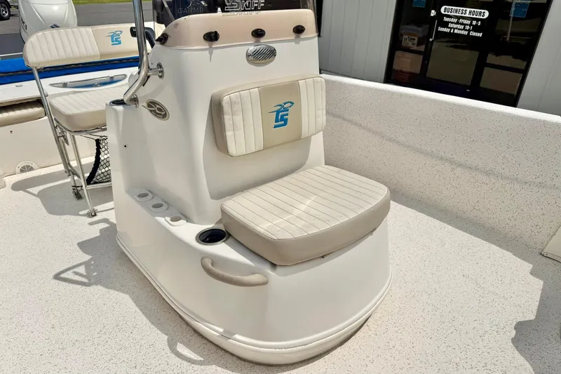 Slide: The Image of 2019 Carolina Skiff 198 DLV boat interior with cushioned seating and console. - 14