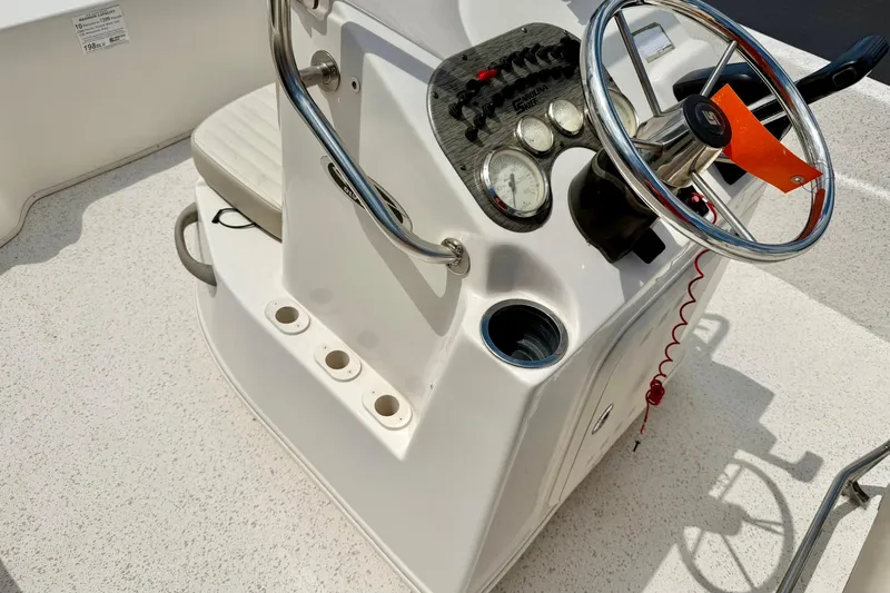 Slide: The Image of 2019 Carolina Skiff 198 DLV boat console with steering wheel and gauges. - 17