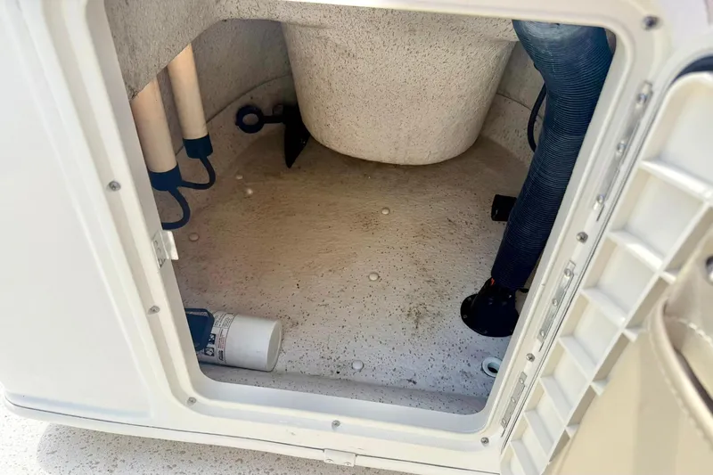 Slide: The Image of Storage compartment of a 2019 Carolina Skiff 198 DLV boat, showing interior details. - 18