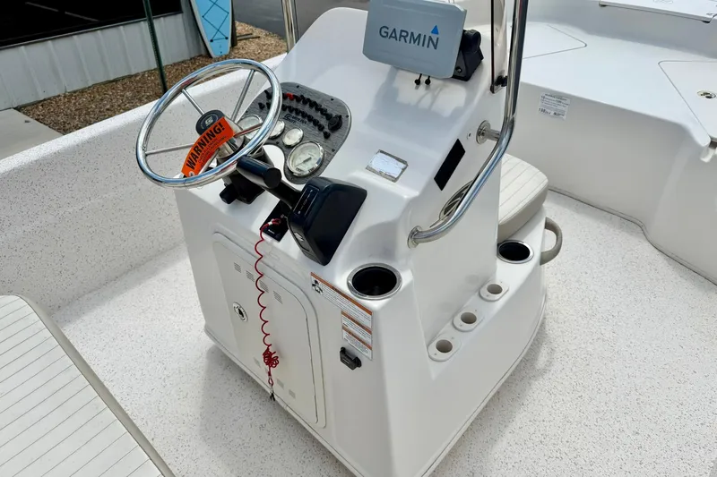 Slide: The Image of 2019 Carolina Skiff 198 DLV boat console with Garmin GPS and steering wheel. - 19