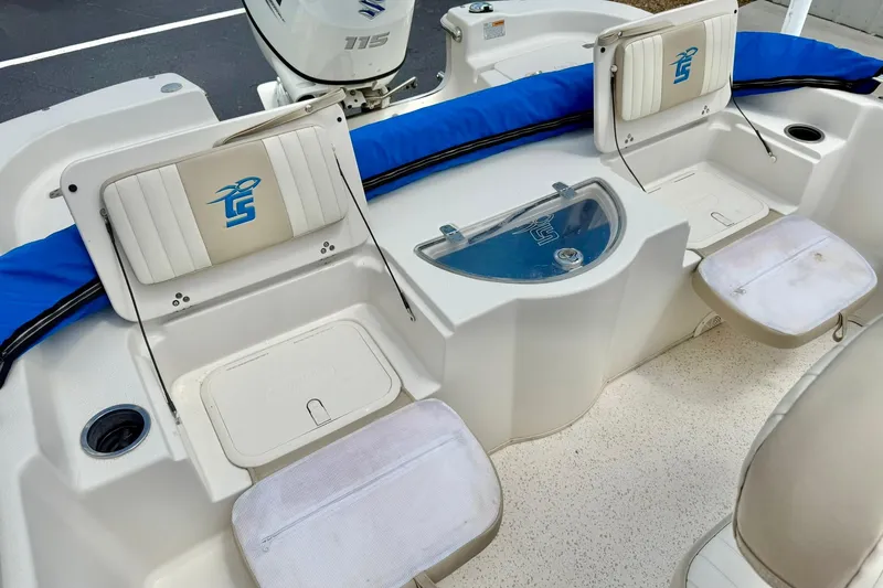 Slide: The Image of 2019 Carolina Skiff 198 DLV boat interior with seating and storage compartments. - 25