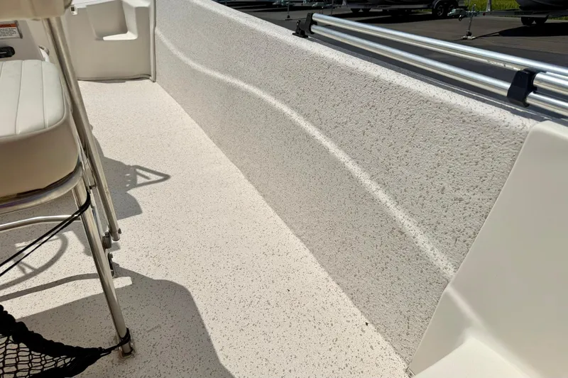 Slide: The Image of 2019 Carolina Skiff 198 DLV boat interior with textured flooring and seating. - 29