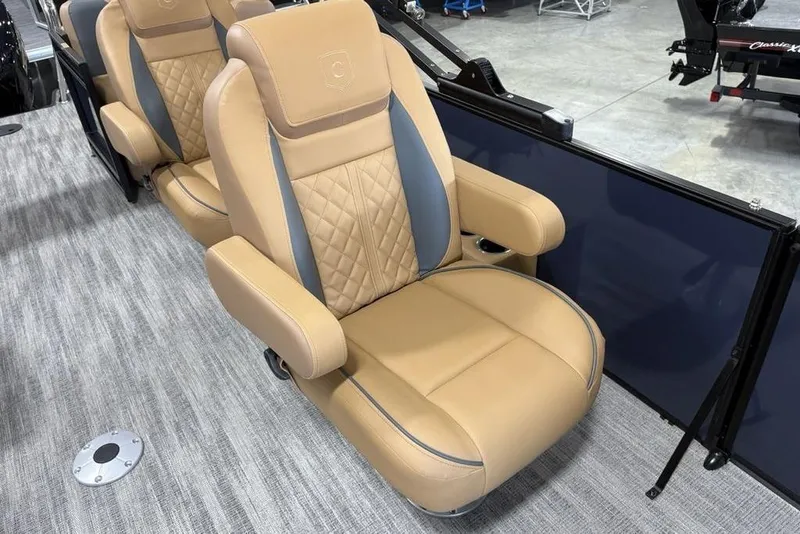 Slide: The Image of Luxurious seating on 2026 Godfrey Sweetwater 2286 QS pontoon boat, featuring tan upholstery. - 19