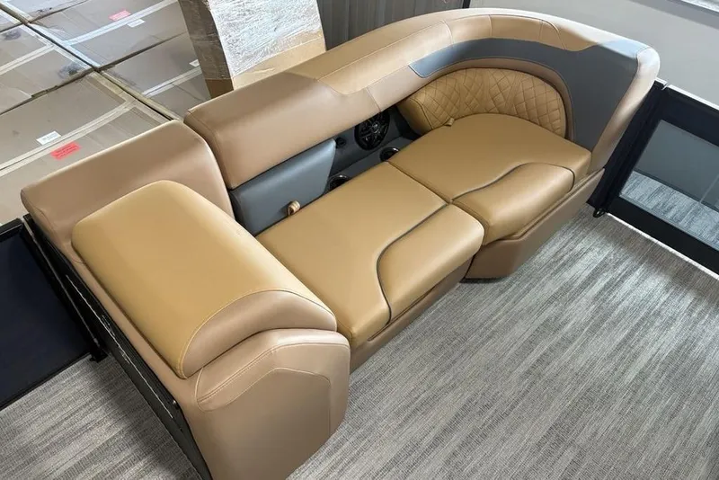 Slide: The Image of Luxurious seating on 2026 Godfrey Sweetwater 2286 QS pontoon boat, featuring tan and gray upholstery. - 9