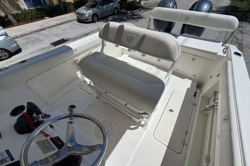 Slide: The Image of 2022 Century 2600 Center Console boat interior with steering wheel and seating. - 13
