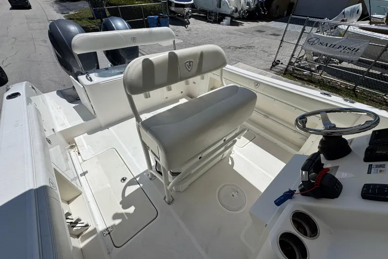 Slide: The Image of 2022 Century 2600 Center Console boat interior with dual seats and steering wheel. - 14