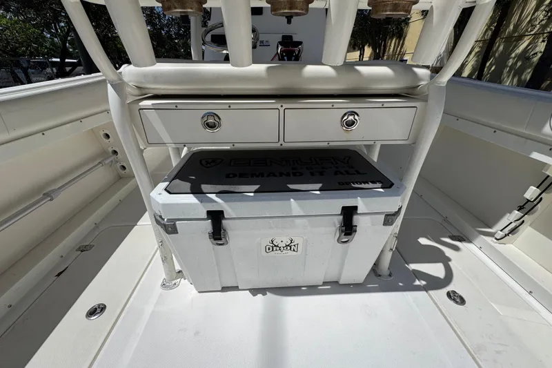 Slide: The Image of 2022 Century 2600 Center Console boat interior with storage and cooler. - 15