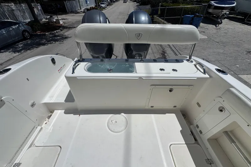 Slide: The Image of 2022 Century 2600 Center Console boat with dual engines and spacious deck layout. - 17