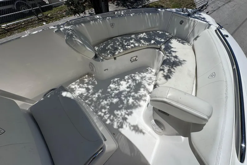 Slide: The Image of 2022 Century 2600 Center Console boat interior with white seating and shadowed sunlight. - 5