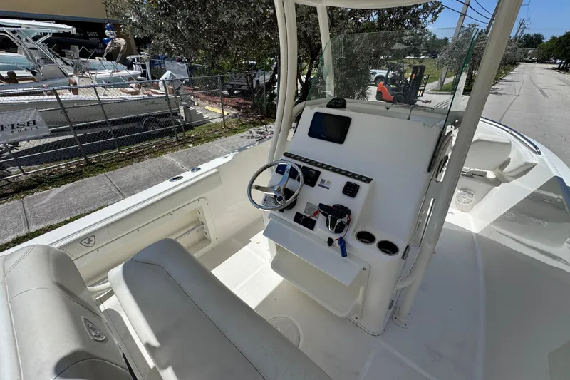 Slide: The Image of 2022 Century 2600 Center Console boat interior with steering wheel and control panel. - 8