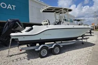 The Image of 2023 Trophy T22 boat on trailer, parked outdoors under a cloudy sky. - 1