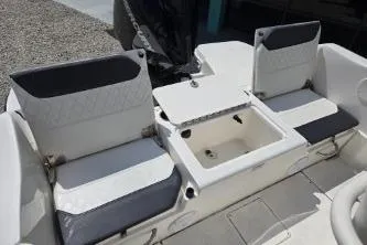 Slide: The Image of 2023 Trophy T22 boat seating area with storage compartment. - 6