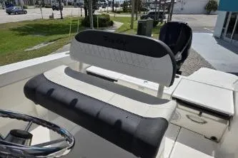 Slide: The Image of 2023 Trophy T22 boat interior with cushioned seating and steering wheel. - 8