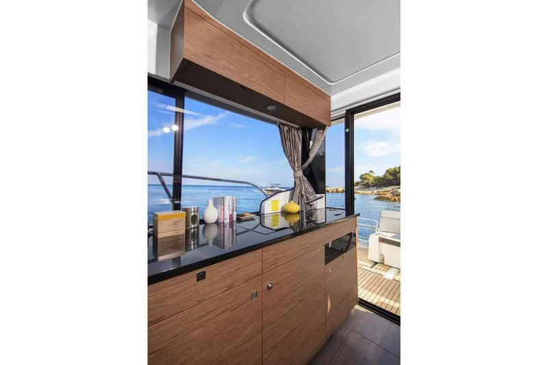 Slide: The Image of Interior of Jeanneau NC 1095 yacht with sea view, 2022 model. - 18