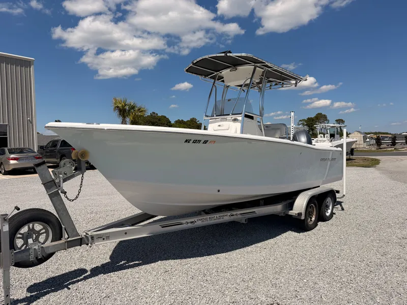 Slide: The Image of 2016 Sea Hunt Triton 225 boat on trailer in sunny weather. - 1