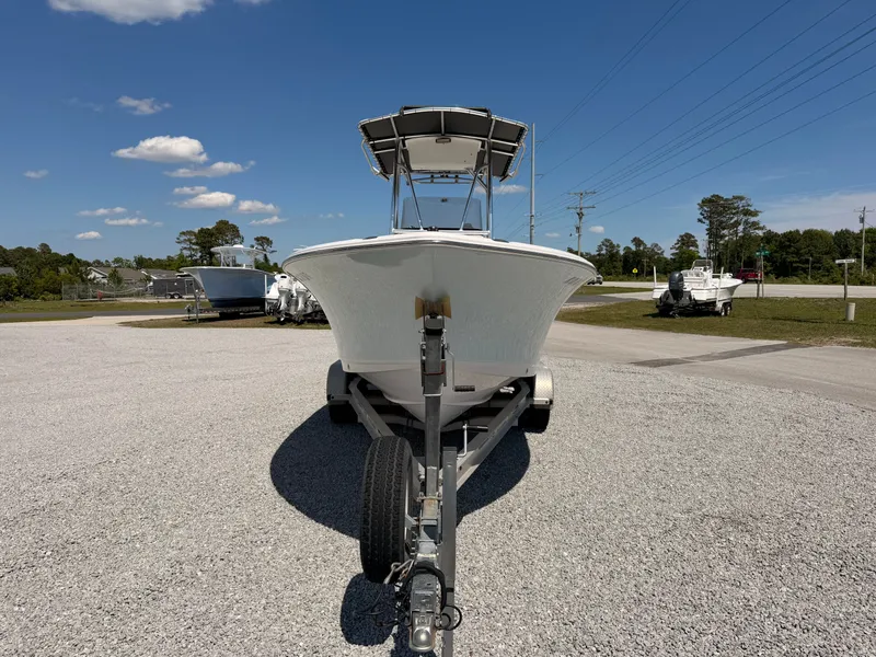 Slide: The Image of 2016 Sea Hunt Triton 225 boat on trailer, blue sky. - 2