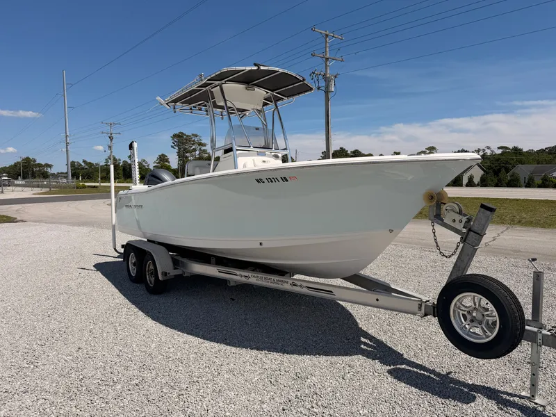 Slide: The Image of 2016 Sea Hunt Triton 225 boat on trailer, sunny day. - 3