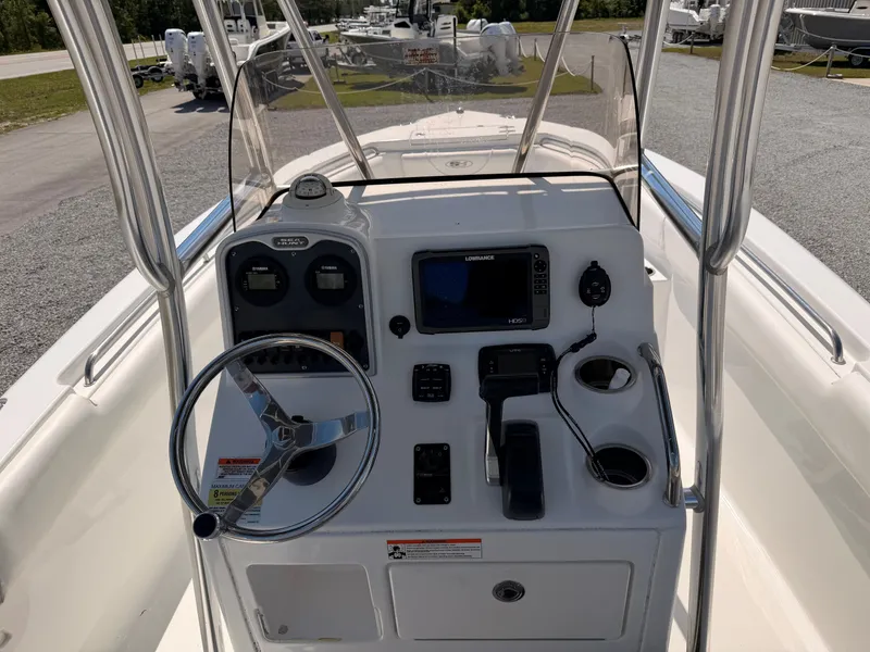 Slide: The Image of 2016 Sea Hunt Triton 225 boat console with steering and electronics. - 6