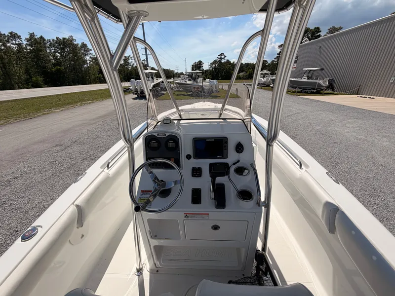 Slide: The Image of Interior view of a 2016 Sea Hunt Triton 225 boat with helm console. - 7