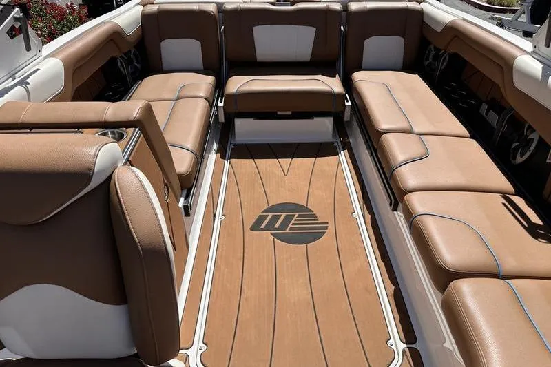 Slide: The Image of Interior of a 2019 Malibu Wakesetter 25 LSV boat with brown leather seating. - 4