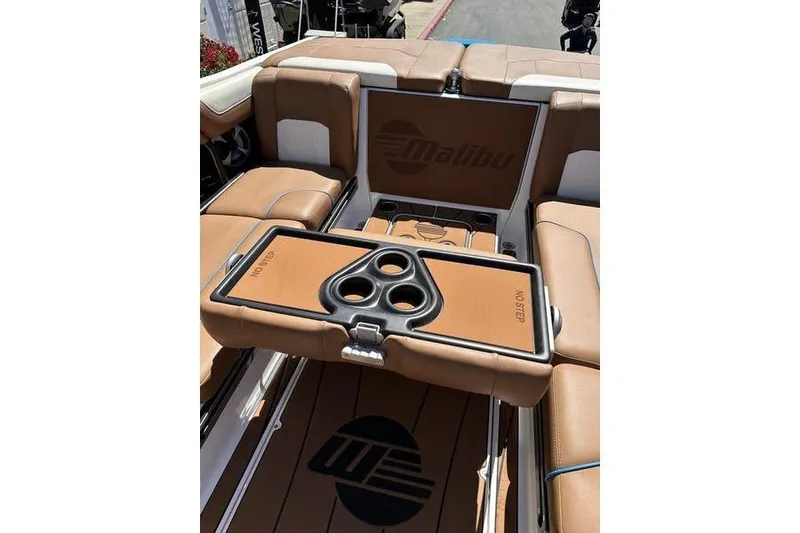 Slide: The Image of 2019 Malibu Wakesetter 25 LSV interior with tan seating and cup holders. - 5