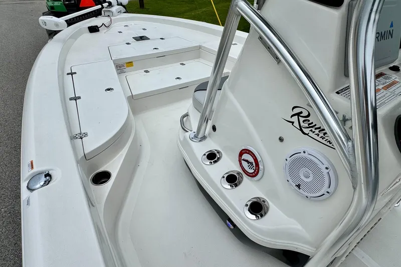 Slide: The Image of 2021 NauticStar 227 XTS boat interior with console and seating area. - 12