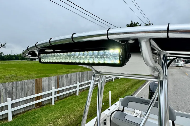 Slide: The Image of 2021 NauticStar 227 XTS boat with LED light bar on T-top. - 18