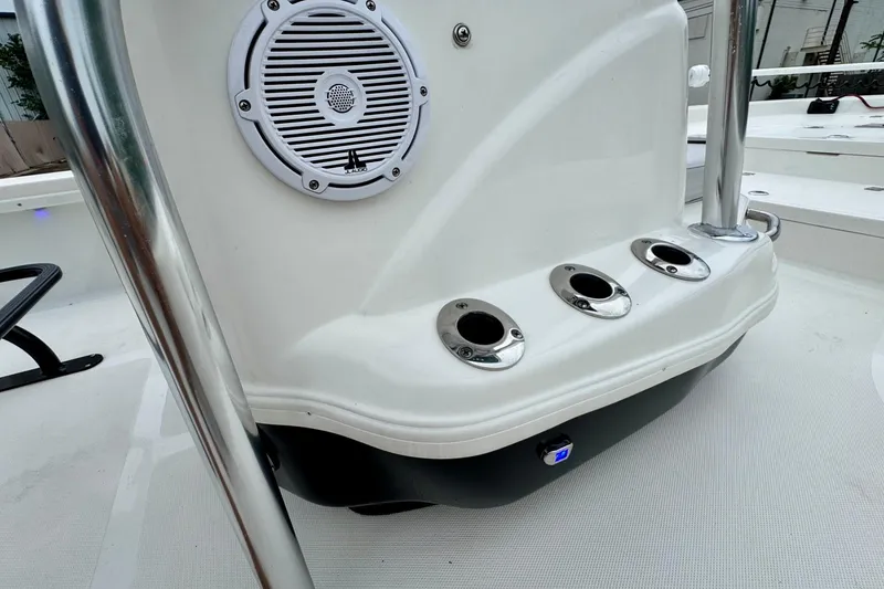 Slide: The Image of 2021 NauticStar 227 XTS boat console with speaker and rod holders. - 20