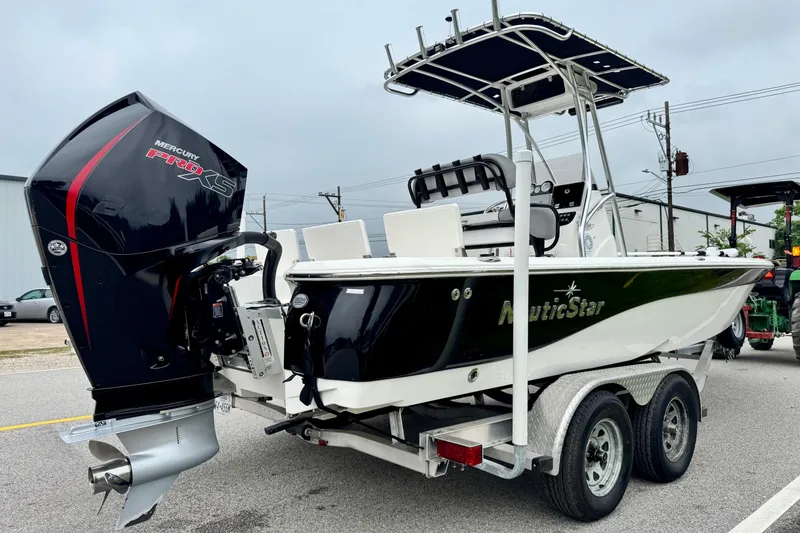 Slide: The Image of 2021 NauticStar 227 XTS boat with Mercury Pro XS engine on a trailer. - 4