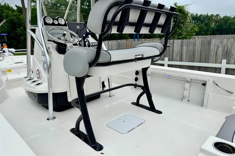 Slide: The Image of 2021 NauticStar 227 XTS boat interior with steering console and seating. - 8