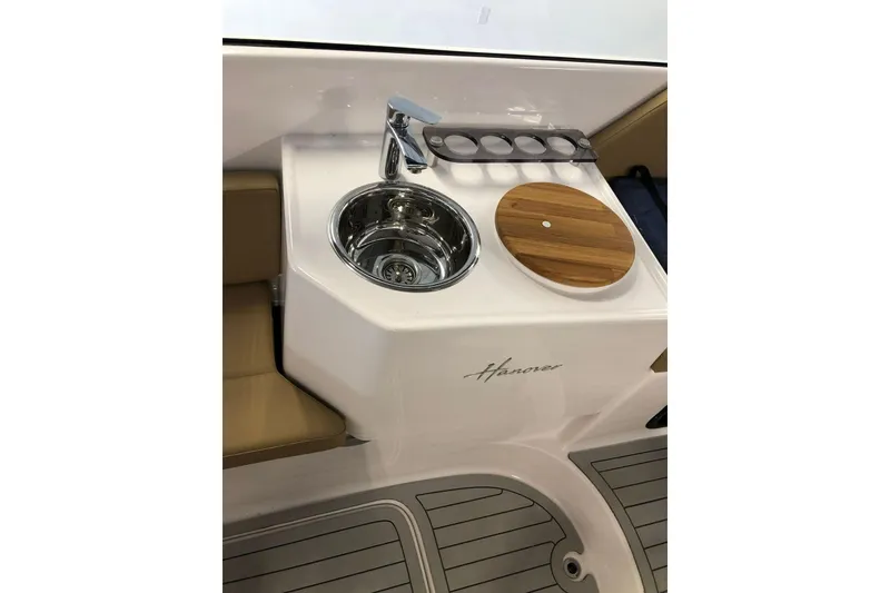 Slide: The Image of 2024 Hanover 305 boat sink with faucet and wooden cover. - 10