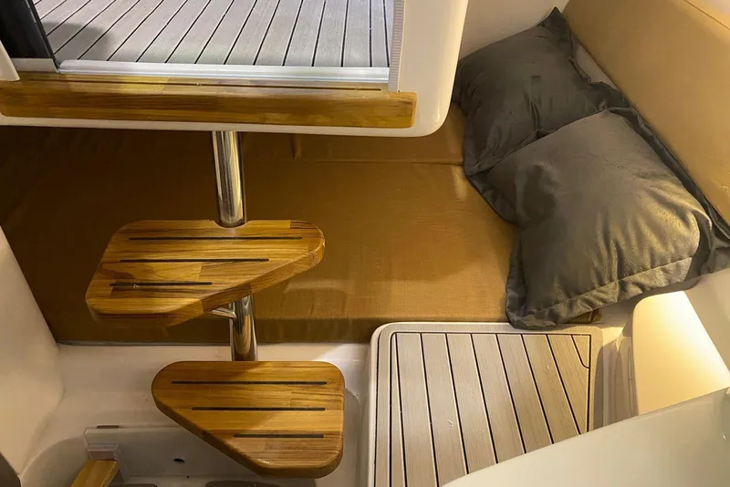 Slide: The Image of 2024 Hanover 305 interior cabin with wooden steps and cozy bedding. - 15