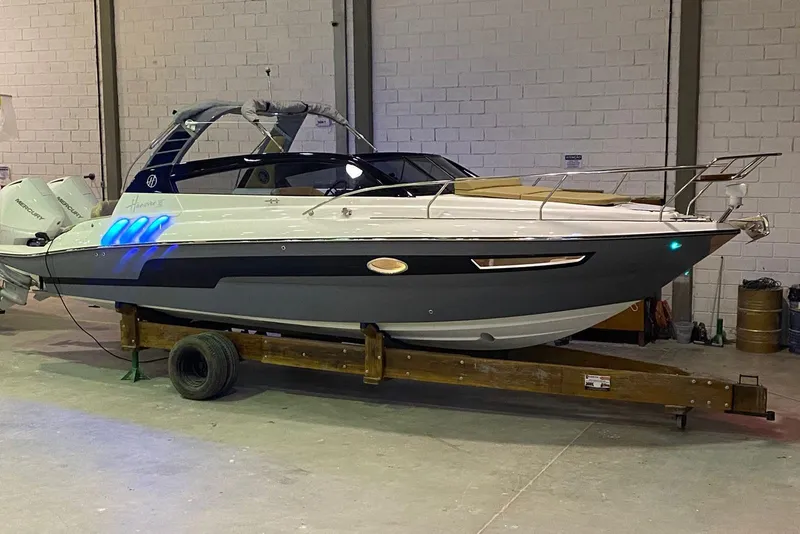 Slide: The Image of 2024 Hanover 305 boat in a warehouse, showcasing sleek design and modern features. - 3