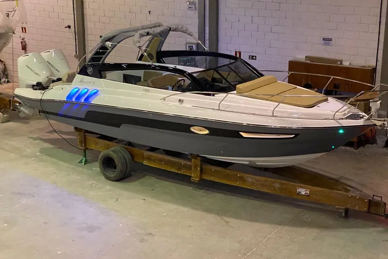 Slide: The Image of 2024 Hanover 305 boat in a workshop, featuring sleek design and modern amenities. - 4