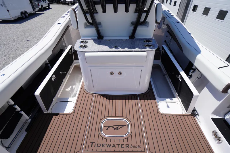 Slide: The Image of 2024 Tidewater 320 CC Adventure boat interior with storage compartments and sleek design. - 23