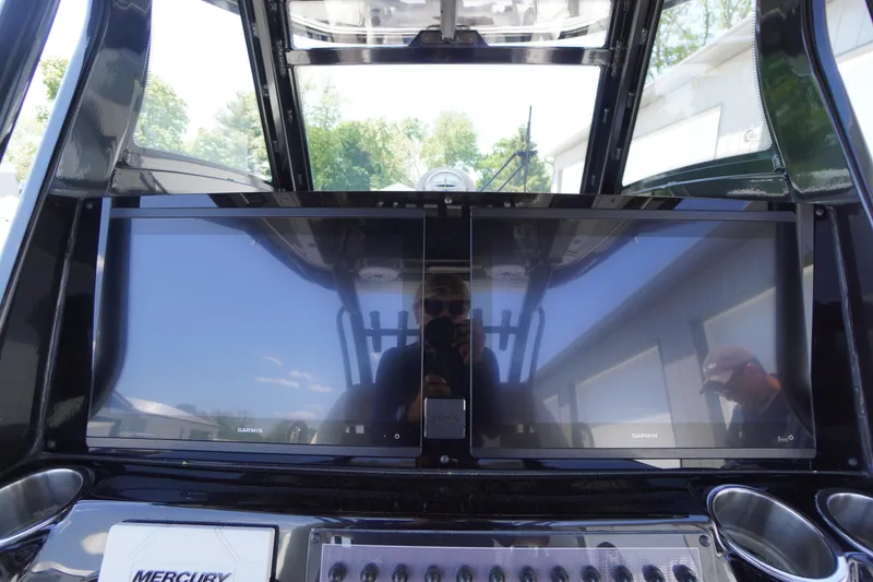 Slide: The Image of 2024 Tidewater 320 CC Adventure dashboard with dual Garmin displays. - 28
