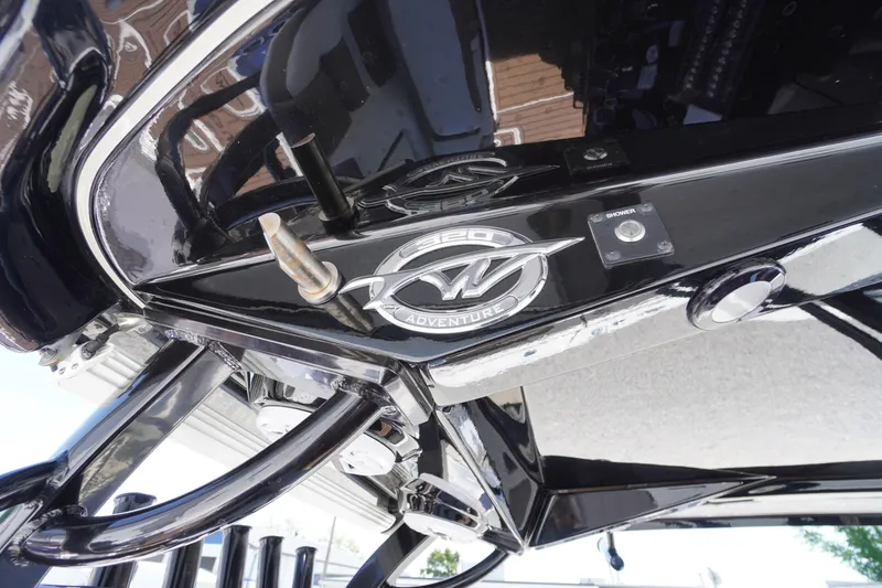 Slide: The Image of 2024 Tidewater 320 CC Adventure boat emblem and details in close-up view. - 29