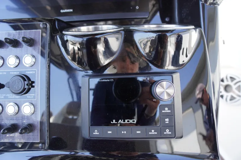 Slide: The Image of Control panel of 2024 Tidewater 320 CC Adventure with JL Audio system and switches. - 33