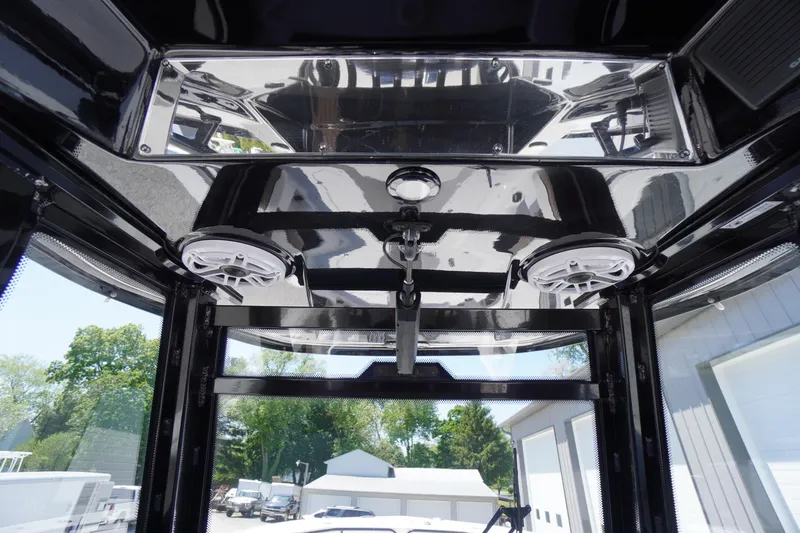 Slide: The Image of 2024 Tidewater 320 CC Adventure boat interior with speakers and sleek design. - 36