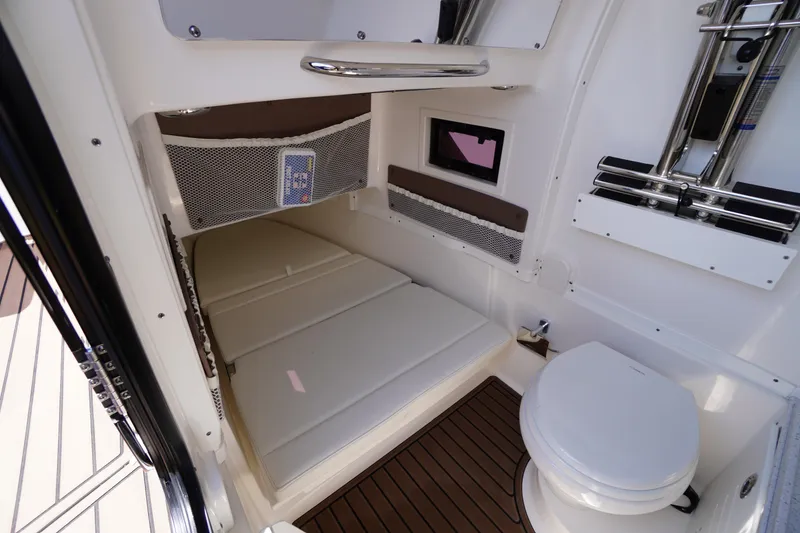 Slide: The Image of 2024 Tidewater 320 CC Adventure cabin with bed, toilet, and storage. - 45