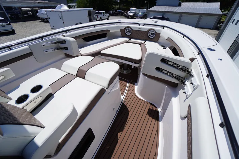 Slide: The Image of 2024 Tidewater 320 CC Adventure boat interior with luxurious seating and modern design. - 49