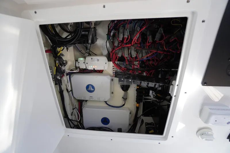 Slide: The Image of Electrical wiring compartment of 2024 Tidewater 320 CC Adventure boat. - 54