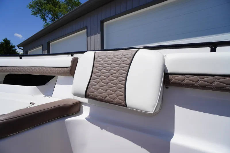 Slide: The Image of 2024 Tidewater 320 CC Adventure boat interior with quilted upholstery detail. - 57