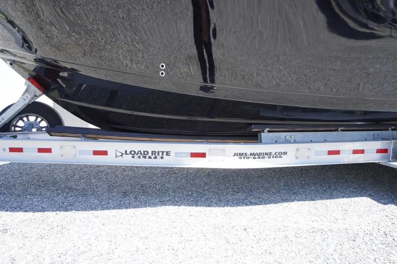 Slide: The Image of 2024 Tidewater 320 CC Adventure boat on Load Rite Elite trailer. - 7