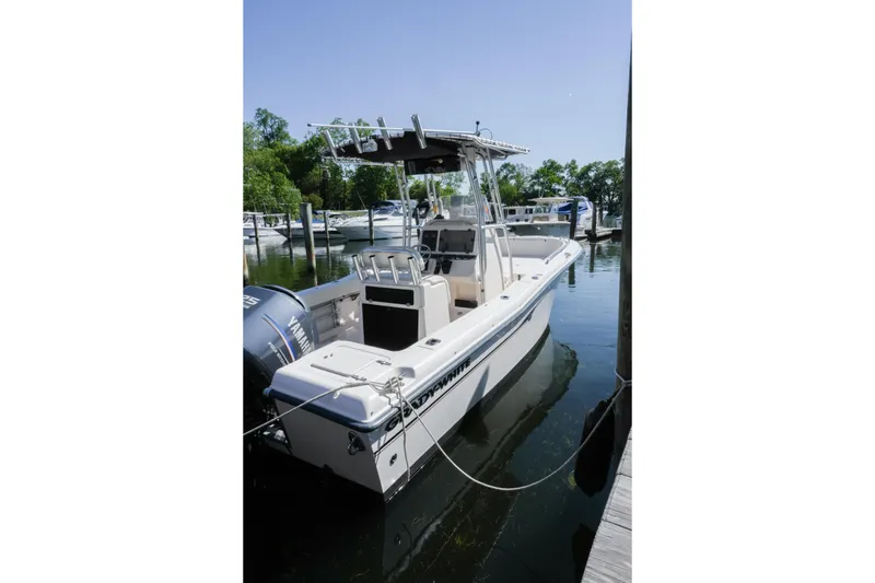 Slide: The Image of 2003 Grady-White Fisherman 222 boat docked in a marina, sunny day. - 4