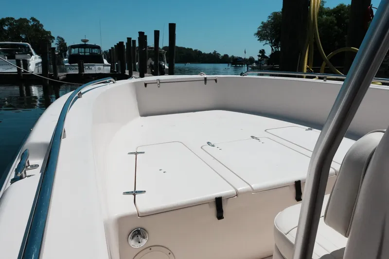 Slide: The Image of 2003 Grady-White Fisherman 222 boat docked at a marina under clear skies. - 8