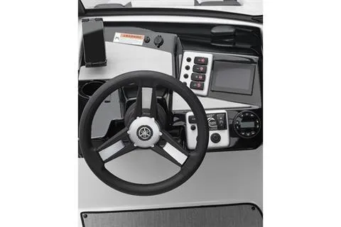 Slide: The Image of 2025 Yamaha AR220 boat dashboard with steering wheel and control panel. - 3