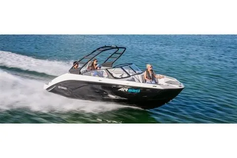 Slide: The Image of 2025 Yamaha AR220 speedboat cruising on open water with passengers. - 7